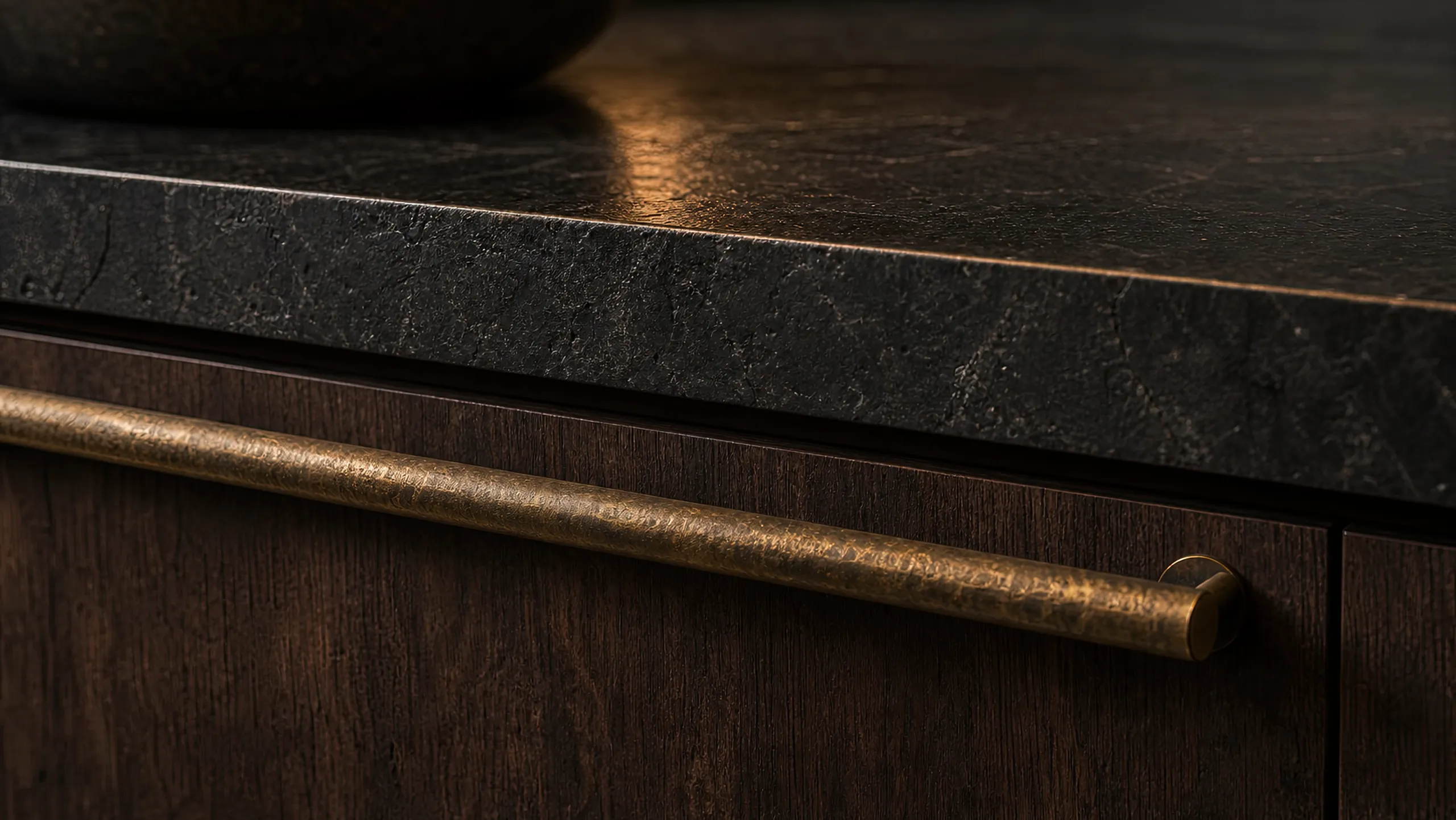 Stone counter with a cast brass handle